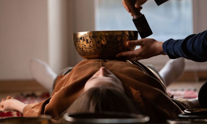 woman receiving vibrational therapy