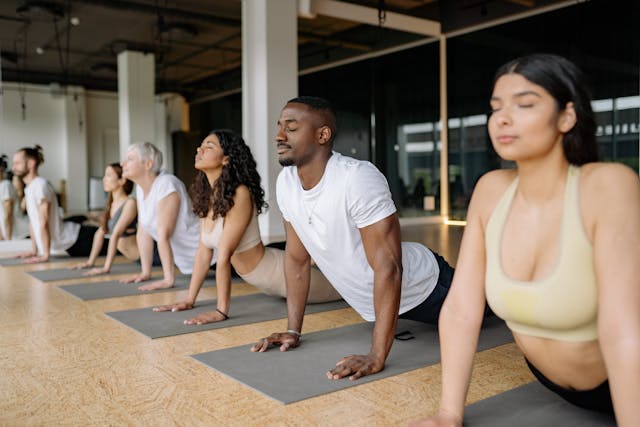 People doing yoga in a studio