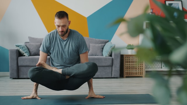 Person doing yoga in their living room