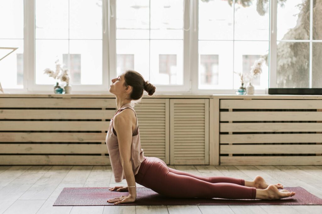 Woman practicing yoga at home