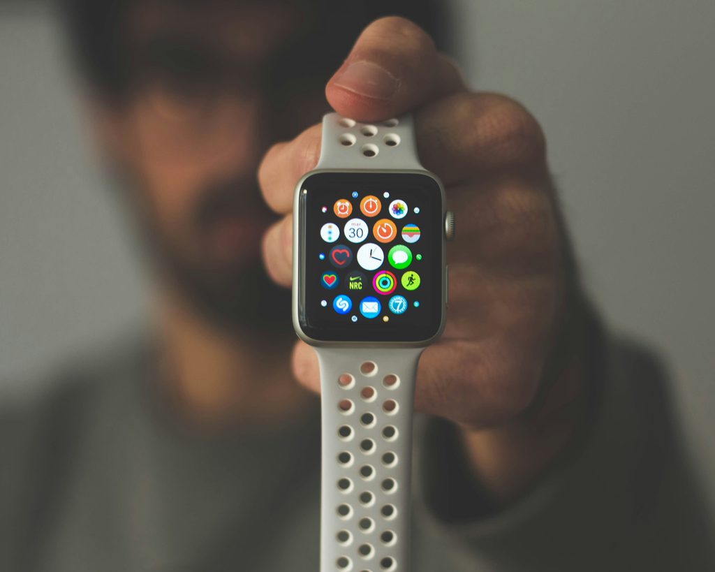 Person holding a smart watch 