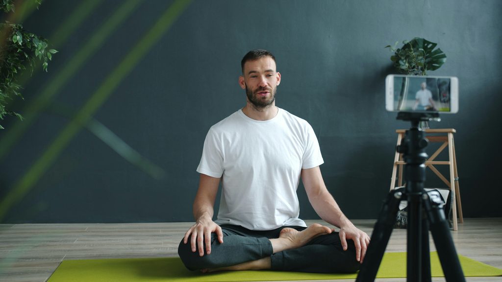 Person filming themselves doing yoga
